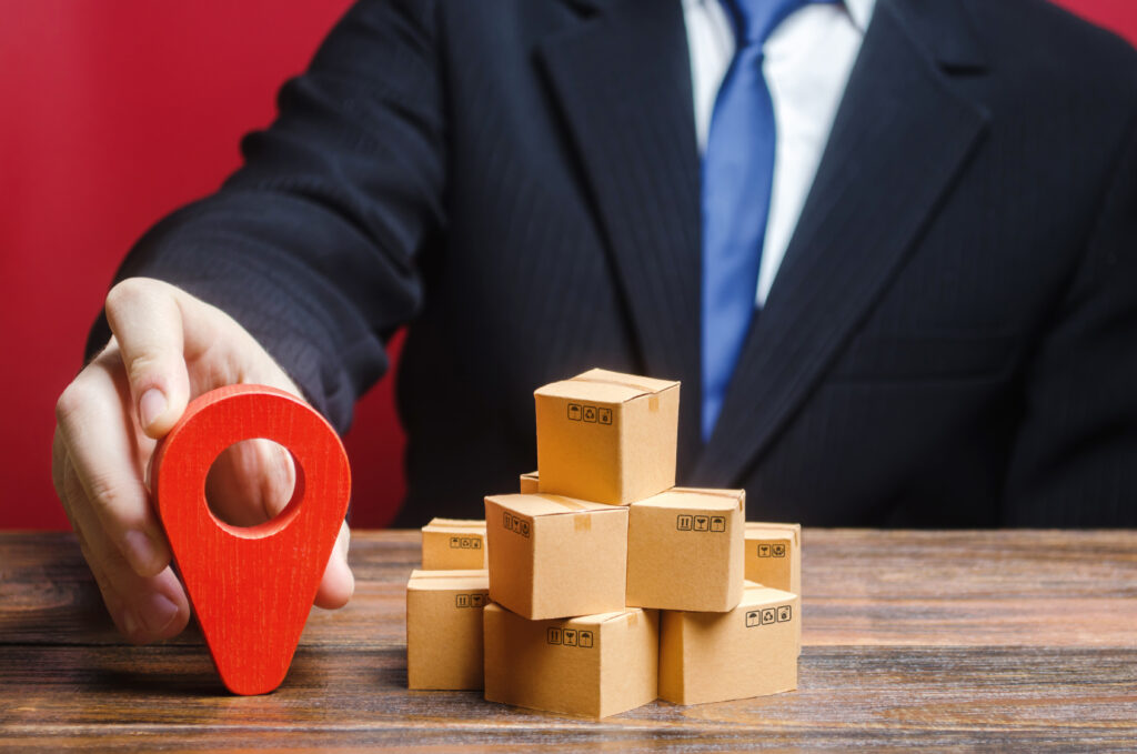 Top Reasons to Start a Courier and Logistics Franchise Right Now a businessman sets a destination for delivery of goods. distribution, freight transportation shipment. logistics and warehousing. global market and business, import and export. trade in new markets.