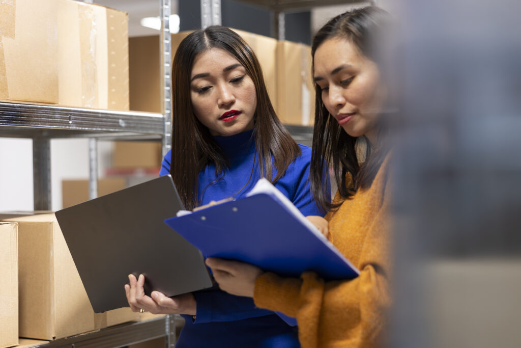 How Strong Logistics Systems Protect Business Reputation startup employees hand packing products in a warehouse shipping area